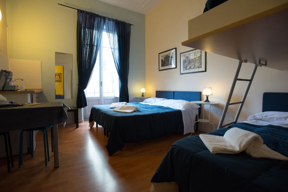 Economy Quadruple Room (External Private Bathroom) | Premium bedding, down comforters, Select Comfort beds, minibar