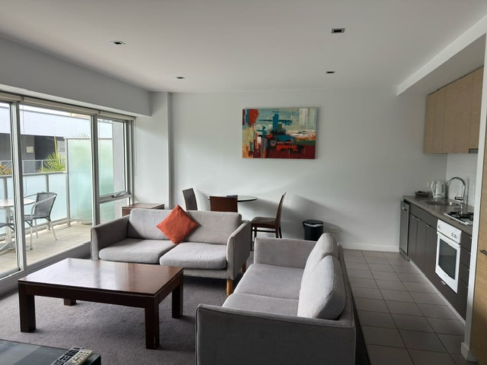 Two Bedroom Apartment | Living area | 24-inch TV with cable channels
