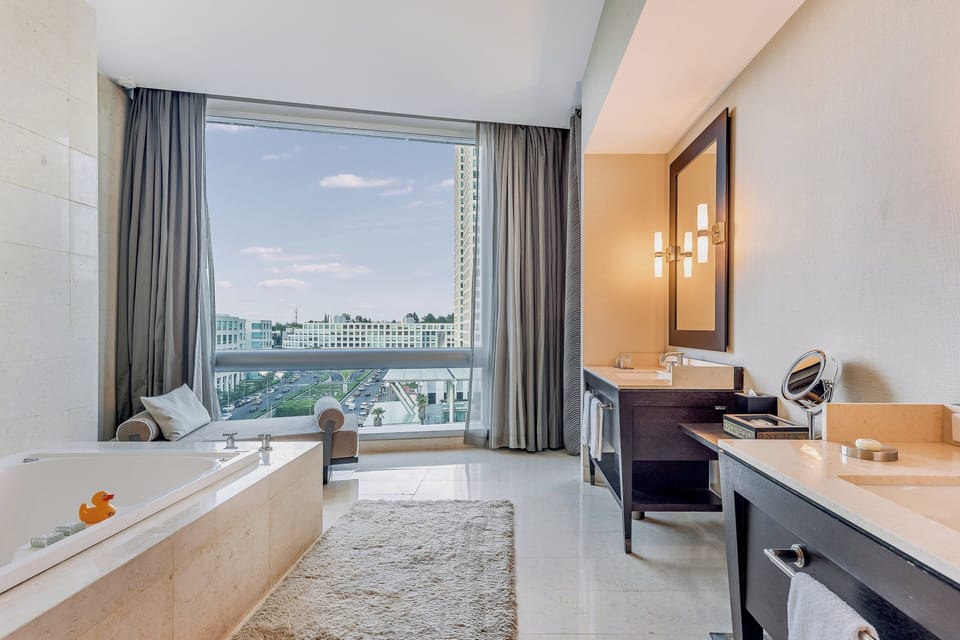 Separate tub and shower, designer toiletries, hair dryer, bathrobes