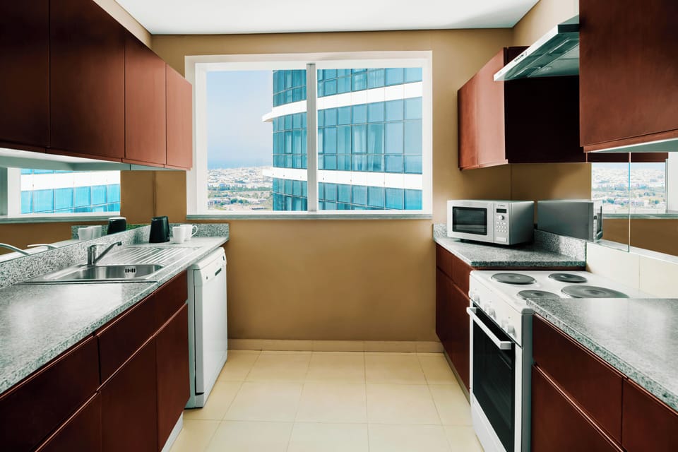 Suite, 2 Bedrooms | Private kitchen | Coffee/tea maker, electric kettle, eco-friendly cleaning products