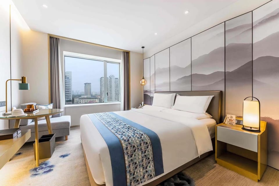Business Double Room | Living area | Flat-screen TV