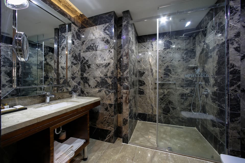 Family Room | Bathroom | Designer toiletries, hair dryer, bathrobes, slippers