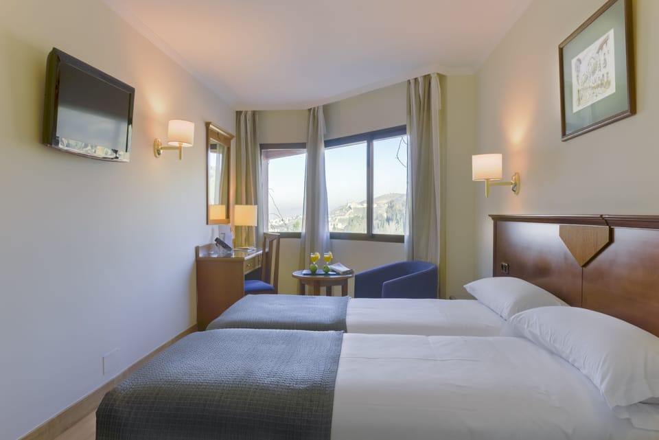 Superior Double or Twin Room | Minibar, in-room safe, desk, laptop workspace