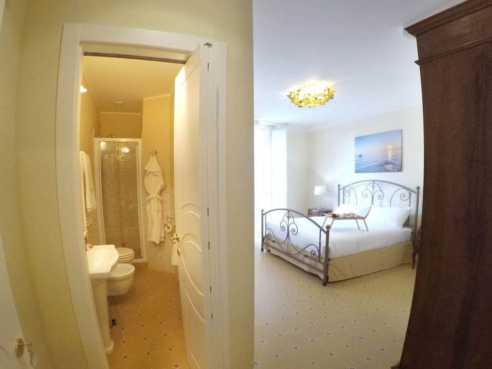 Deluxe Double Room, Balcony, City View | Minibar, in-room safe, individually decorated, individually furnished