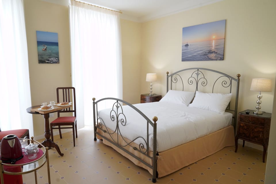 Deluxe Double Room, Balcony, City View | Minibar, in-room safe, individually decorated, individually furnished