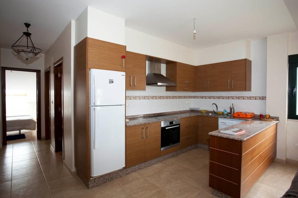 Full-size fridge, microwave, stovetop, coffee/tea maker