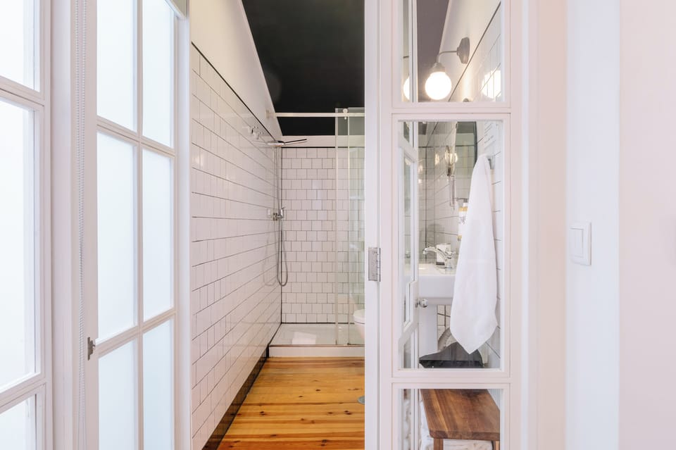 Economy Double Room, 1 Double Bed | Bathroom | Shower, rainfall showerhead, hair dryer, towels