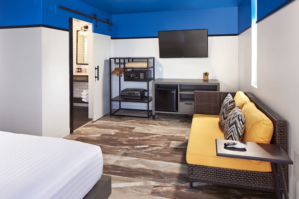 Room, 2 Double Beds, Partial Ocean View | Living area | 50-inch TV with cable channels, pay movies