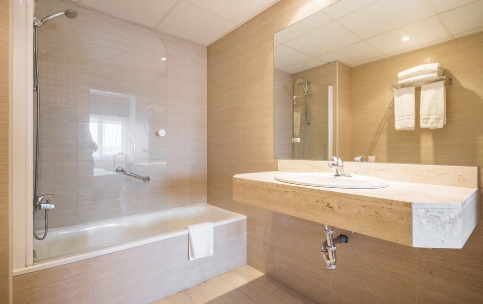Eco-friendly toiletries, hair dryer, towels