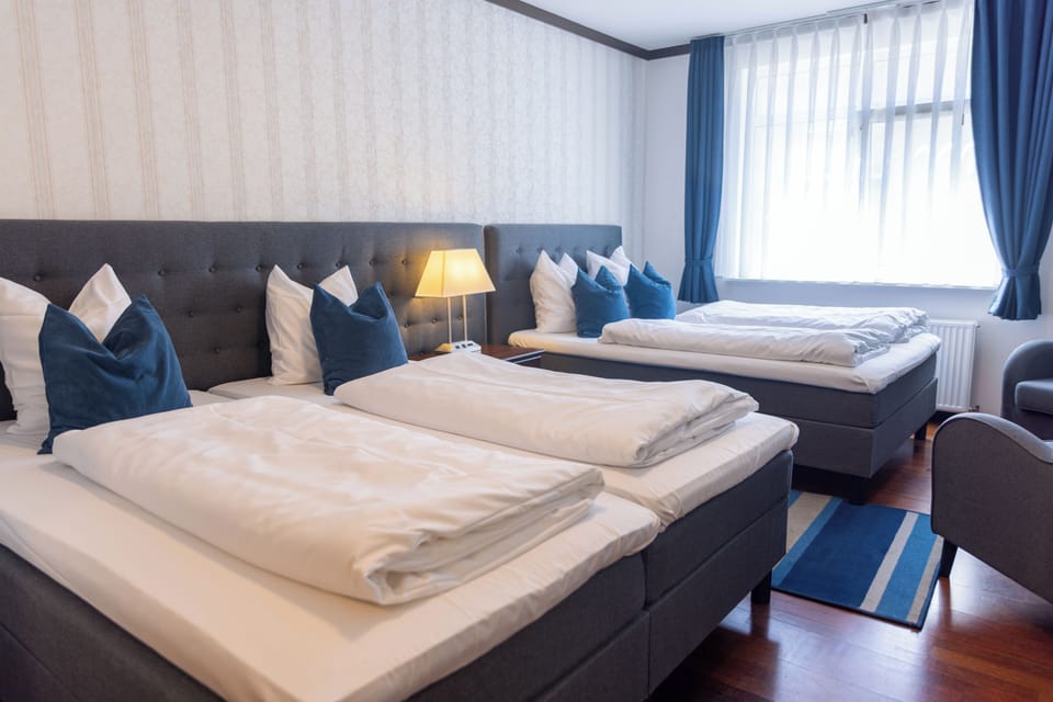Family Quadruple Room | Hypo-allergenic bedding available, desk, WiFi (free), bed sheets