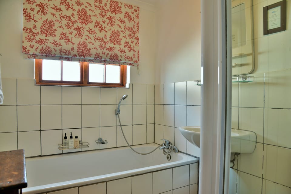 Separate tub and shower, rainfall showerhead, free toiletries