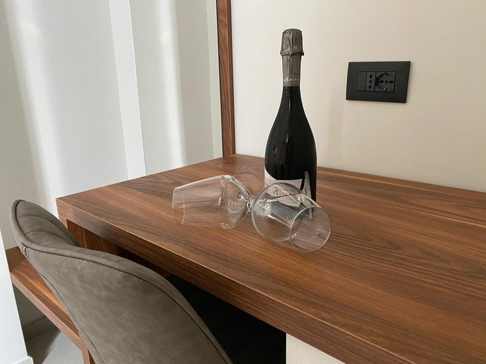 Minibar, desk, bed sheets