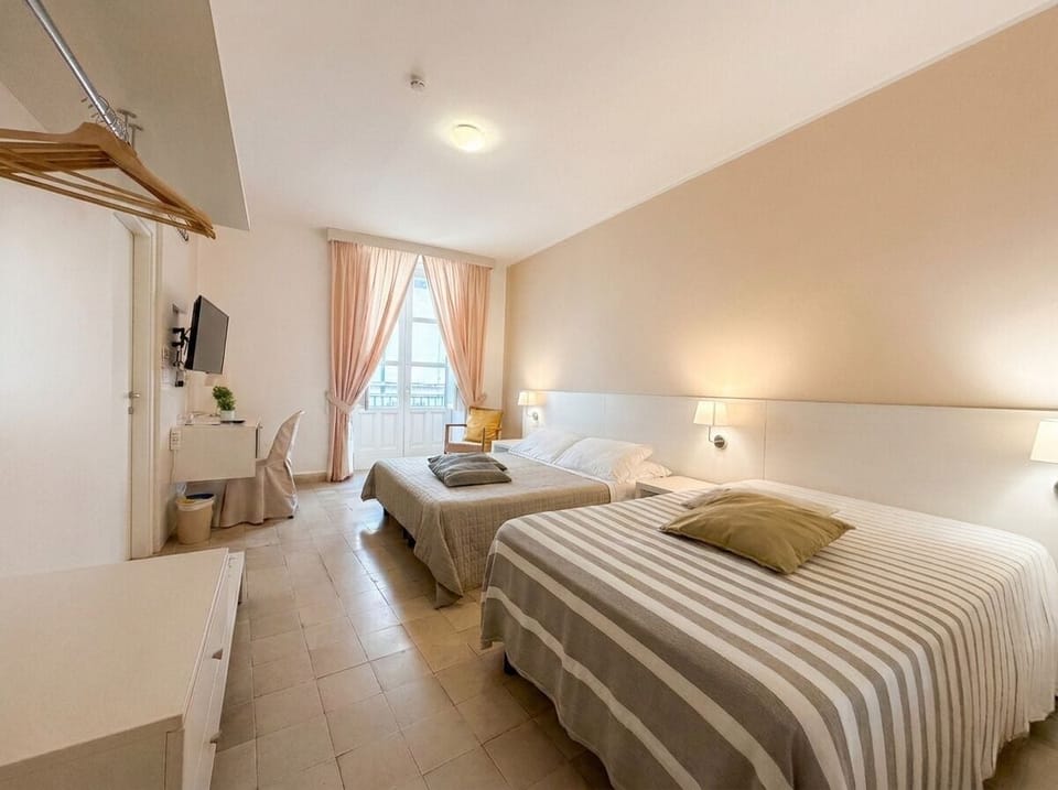 Triple Room, Balcony, Partial Sea View | Down comforters, minibar, desk, free WiFi