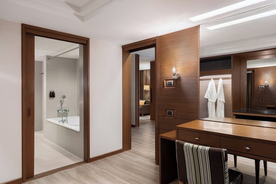 1 Bedroom Suite with Exclusive Benefits | Bathroom | Designer toiletries, hair dryer, bathrobes, slippers