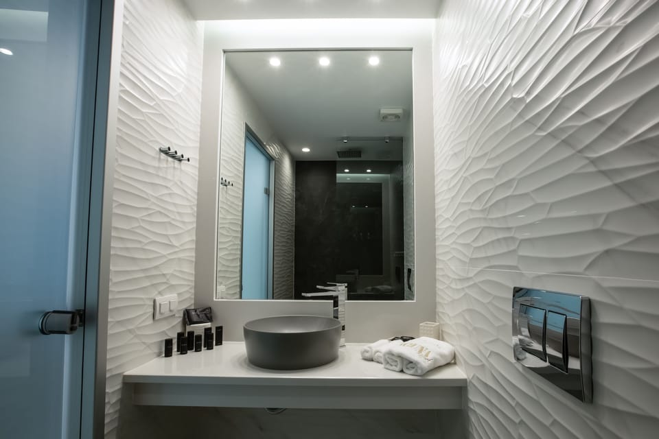 Shower, free toiletries, hair dryer, bathrobes