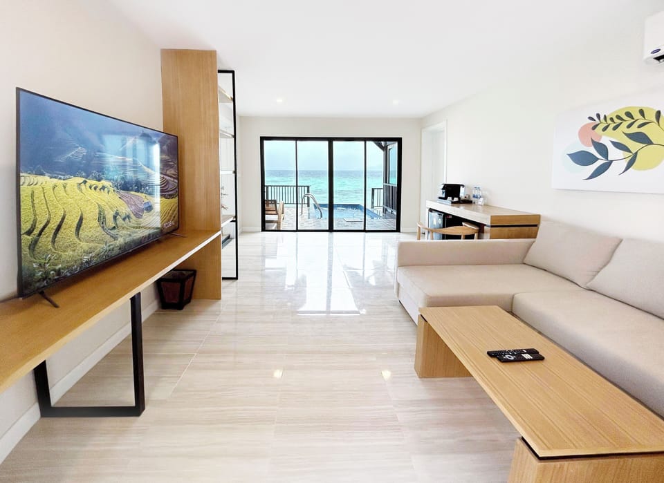 Two-Bedroom Suite | Living area | 32-inch flat-screen TV with cable channels, TV