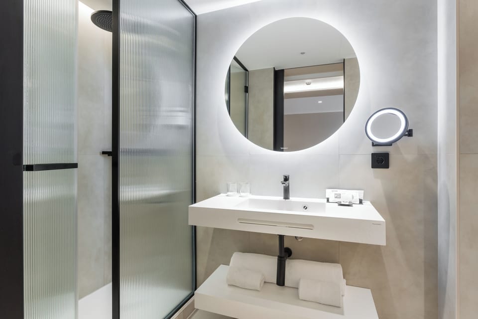 Family Room, 1 King Bed with Sofa bed | Bathroom | Eco-friendly toiletries, hair dryer, slippers, towels