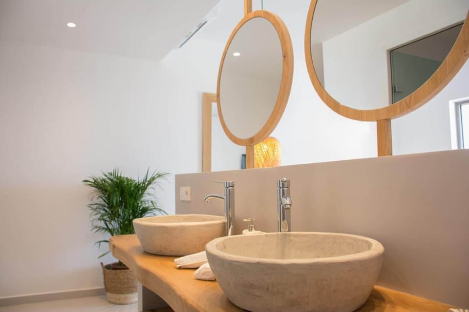 Shower, designer toiletries, hair dryer, slippers