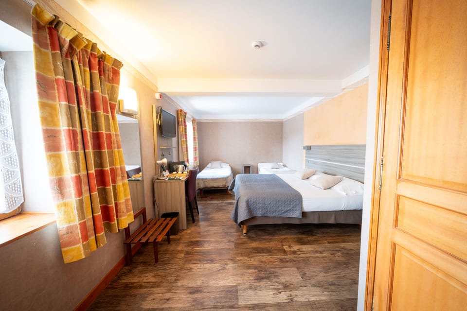 Standard Quadruple Room | Desk, blackout drapes, soundproofing, iron/ironing board