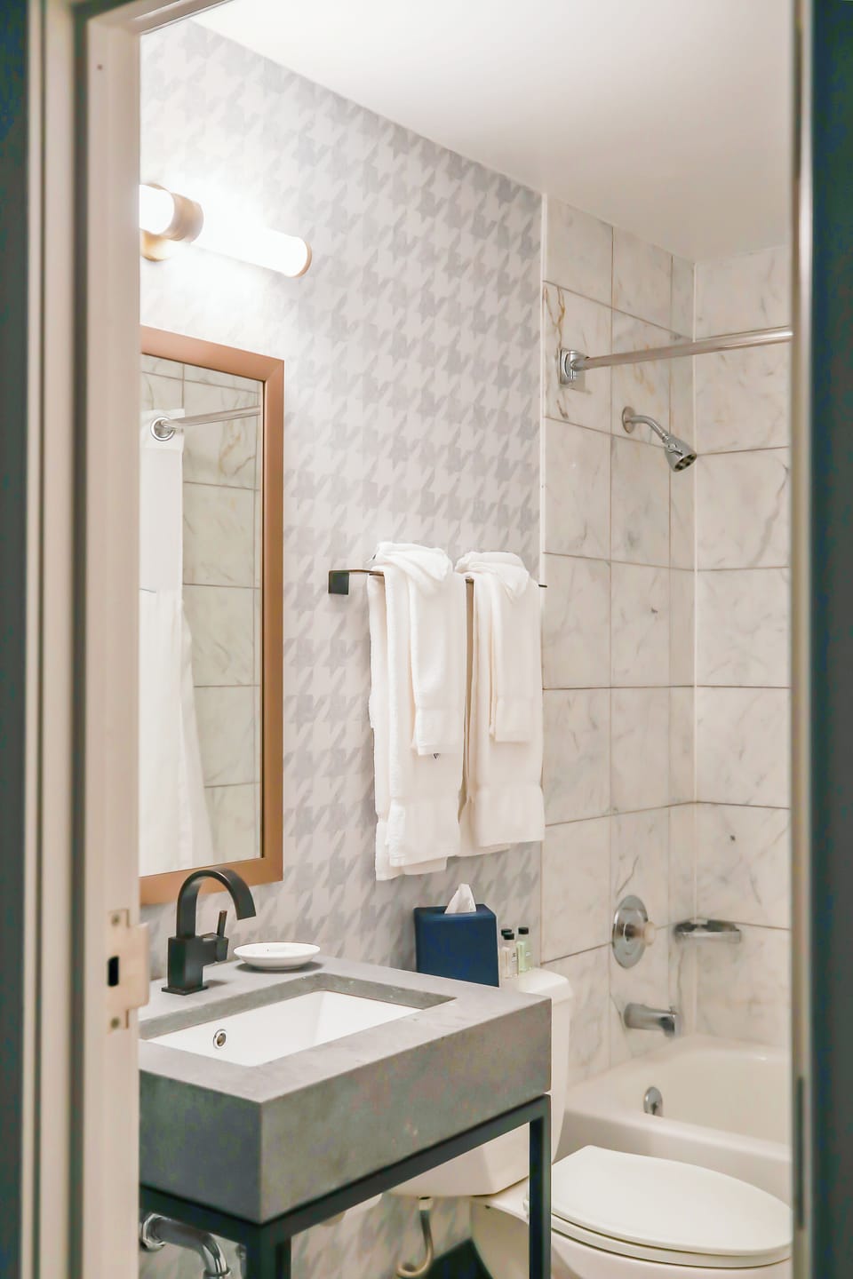 Combined shower/tub, designer toiletries, hair dryer, bathrobes