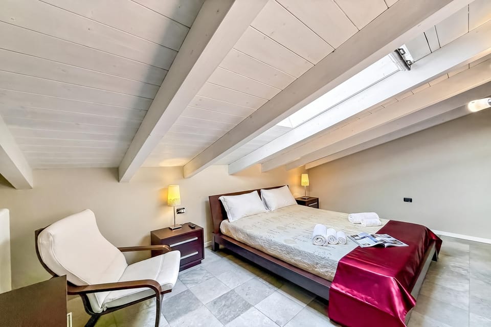 Family Apartment, 2 Bedrooms, 2 Bathrooms, Mountainside (Mansarda di Pianello) | 2 bedrooms, WiFi (surcharge), bed sheets