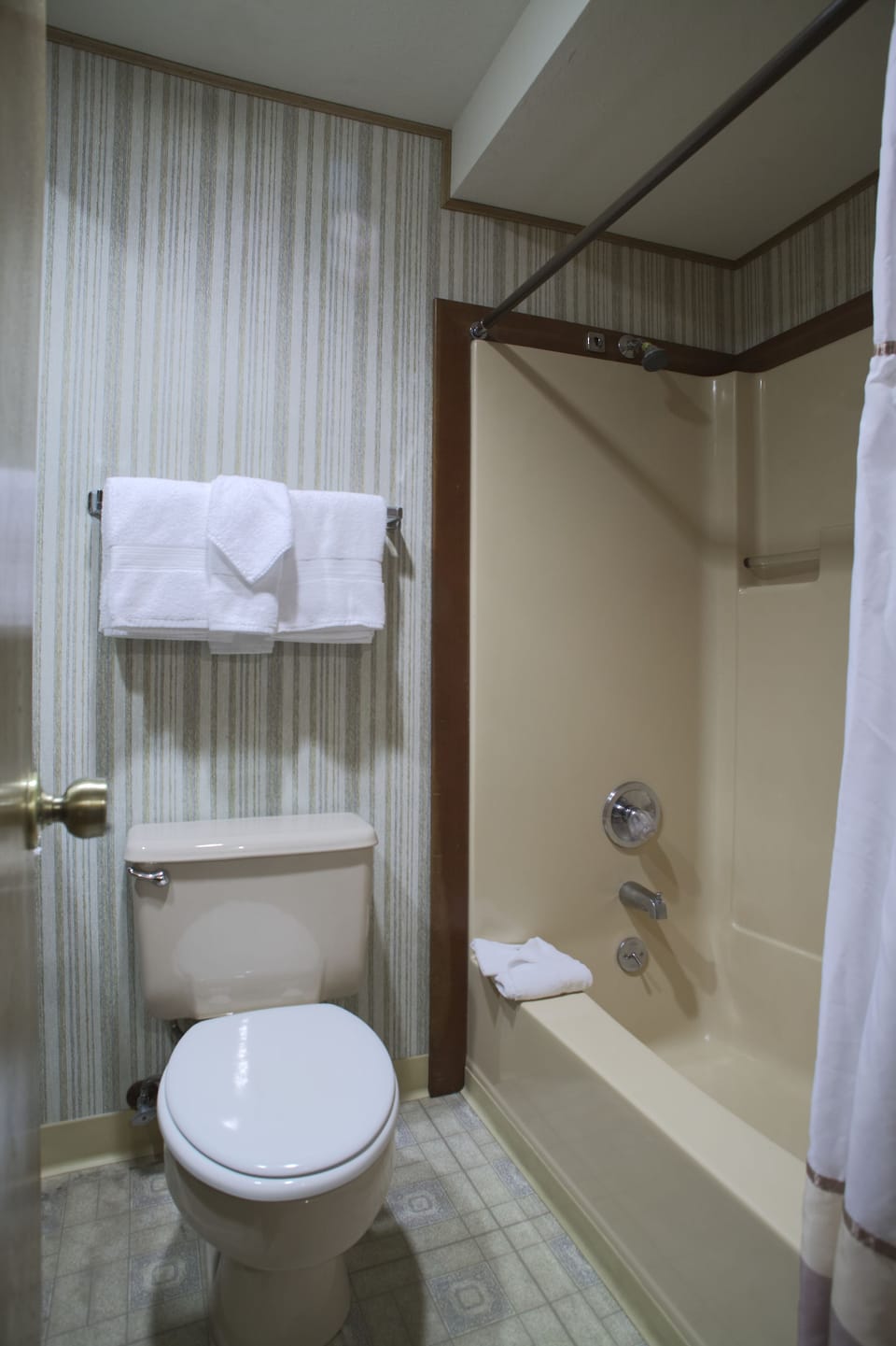 Room, 1 King Bed (Located in building across the street) | Bathroom | Combined shower/tub, hair dryer, towels