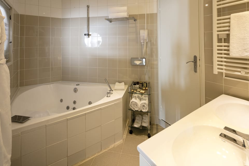 Suite, Balcony, Sea View | Bathroom | Hair dryer, slippers, towels