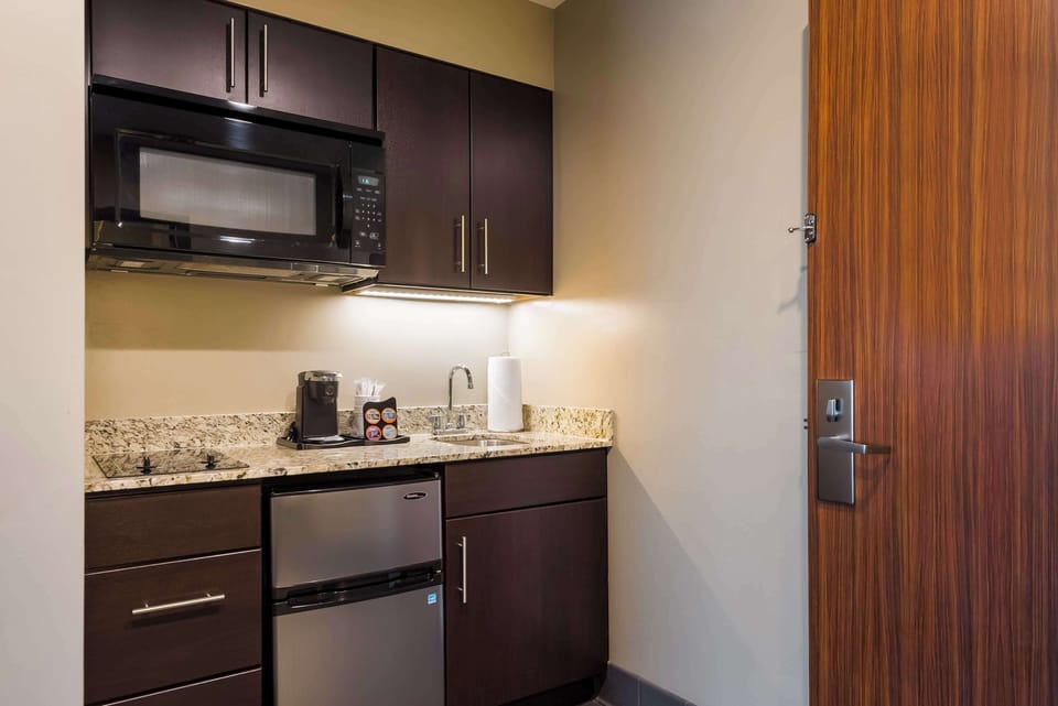 Fridge, microwave, coffee/tea maker, cookware/dishes/utensils
