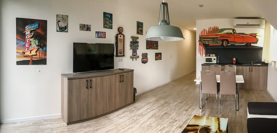Cadillac Apartment | Living area | 102-cm LCD TV with digital channels, TV