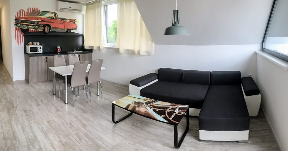 Cadillac Apartment | Living area | 102-cm LCD TV with digital channels, TV