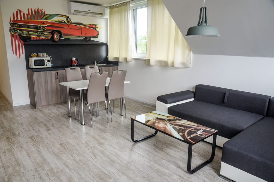 Cadillac Apartment | Living area | 102-cm LCD TV with digital channels, TV