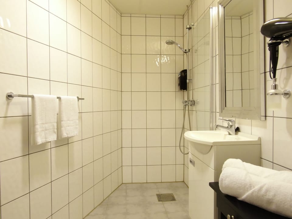 Panoramic Double Room, 1 King Bed with Sofa bed, Sea View | Bathroom | Shower, hair dryer, heated floors, towels