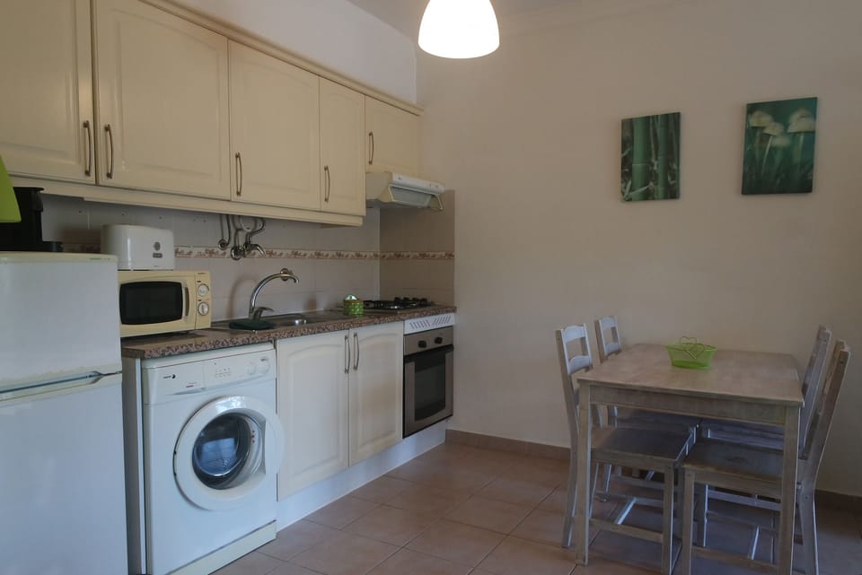 Apartment, 1 Bedroom | Private kitchen | Full-size fridge, stovetop, cookware/dishes/utensils