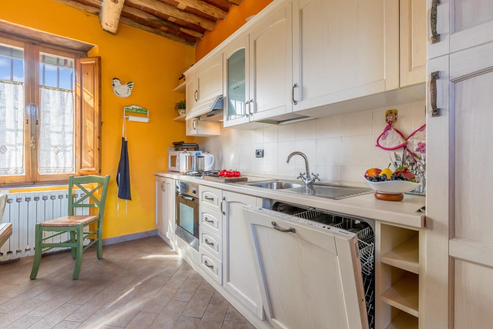 Family House, 2 Bedrooms, Fireplace, Mountainside (Casale Geniva with private pool) | Private kitchen | Full-size fridge, microwave, oven, stovetop