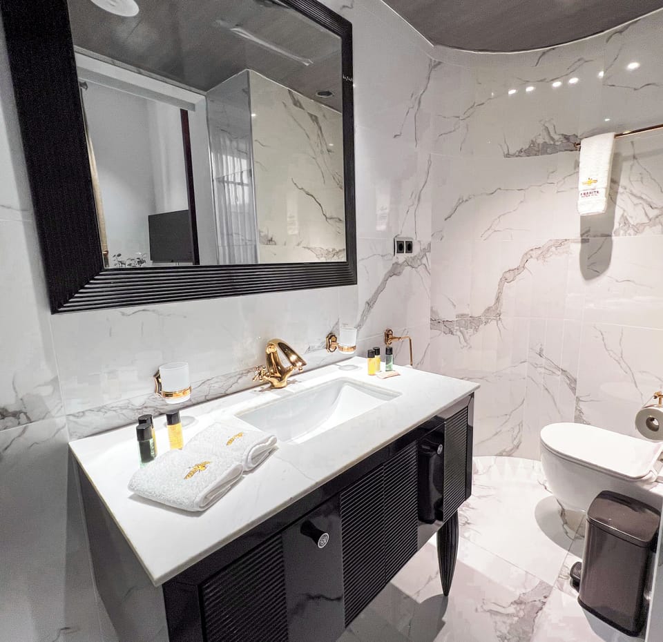 Economy Double Room | Bathroom | Separate tub and shower, jetted tub, rainfall showerhead, hair dryer