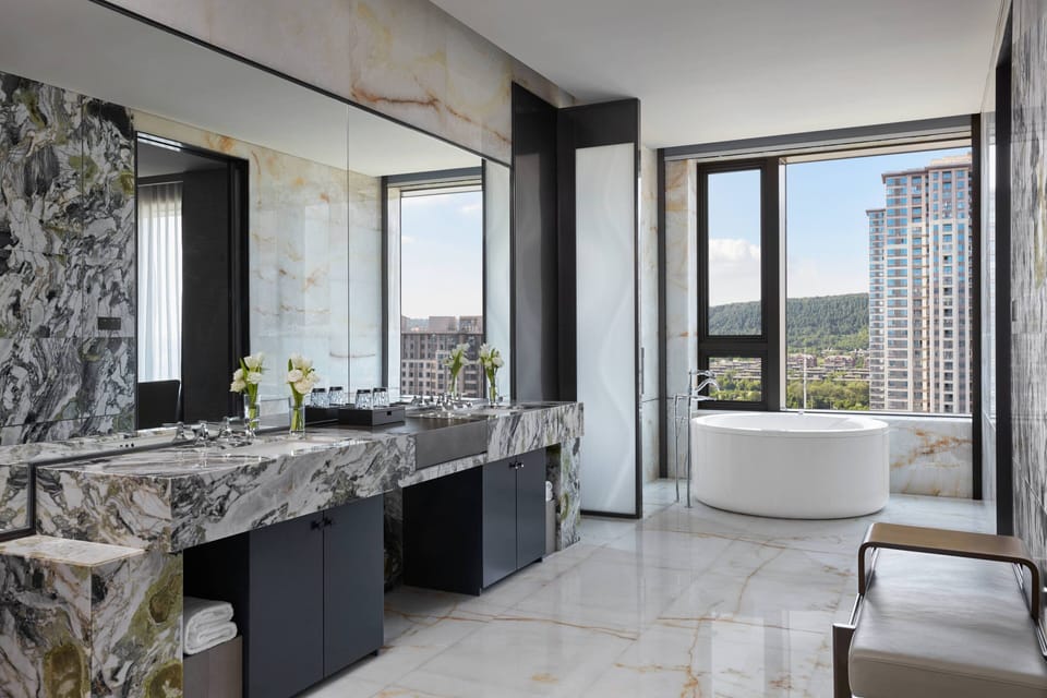 Separate tub and shower, rainfall showerhead, hair dryer, bathrobes
