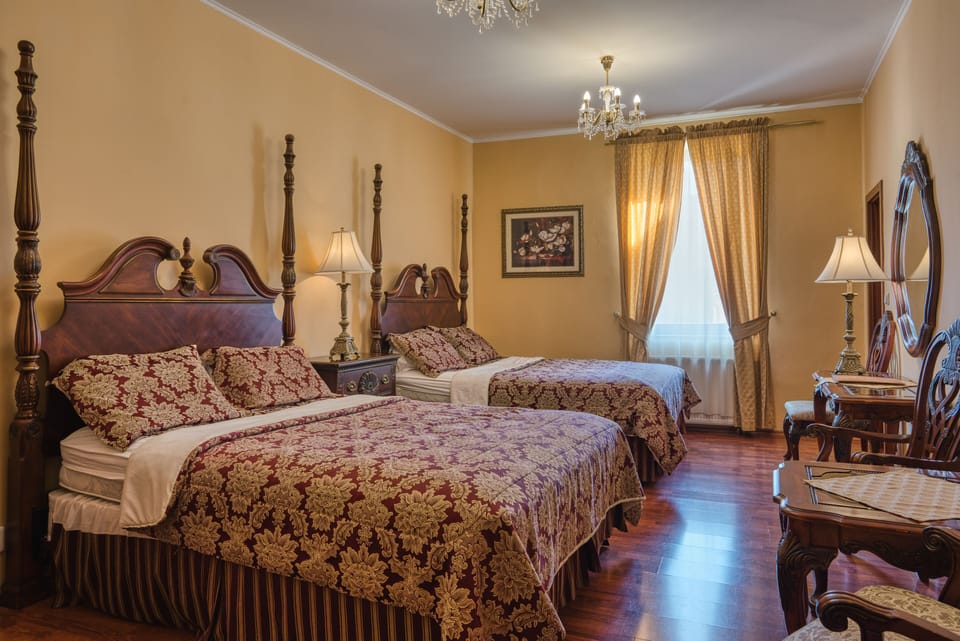 Deluxe Quadruple Room | In-room safe, desk, laptop workspace, blackout drapes