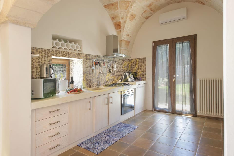 Villa, 4 Bedrooms | Private kitchen | Espresso maker, coffee/tea maker, full-size fridge, microwave