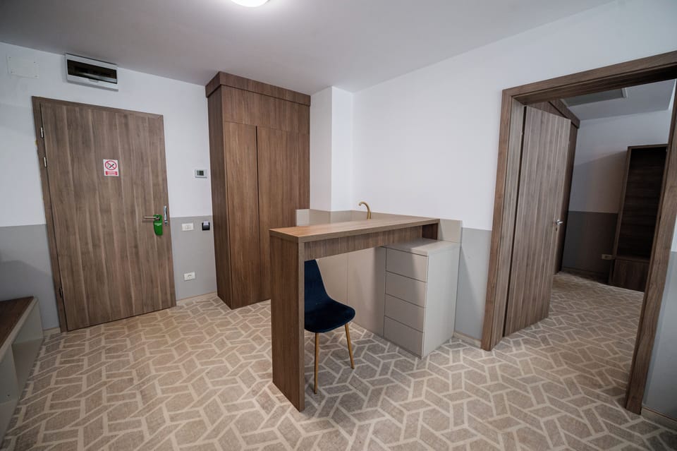 Suite, Balcony | Minibar, desk, laptop workspace, blackout drapes