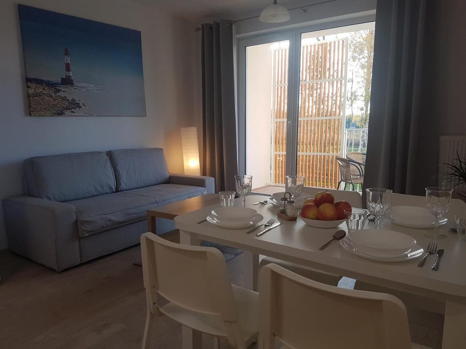 Standard Apartment | Living area | 26-inch flat-screen TV with digital channels, TV