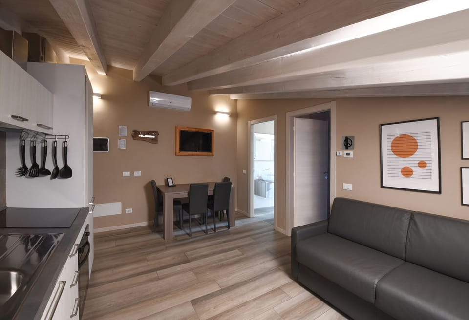 Apartment (5 Adults Apt 27) | Living area | 32-inch flat-screen TV with cable channels, TV