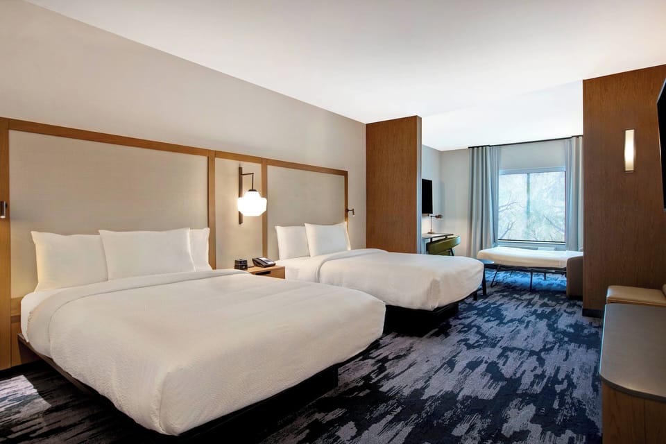 Suite, Multiple Beds | 1 bedroom, down comforters, desk, laptop workspace