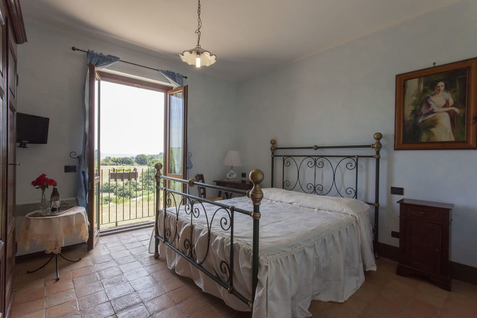 Double Room, Lake View | Iron/ironing board, cribs/infant beds, rollaway beds, free WiFi