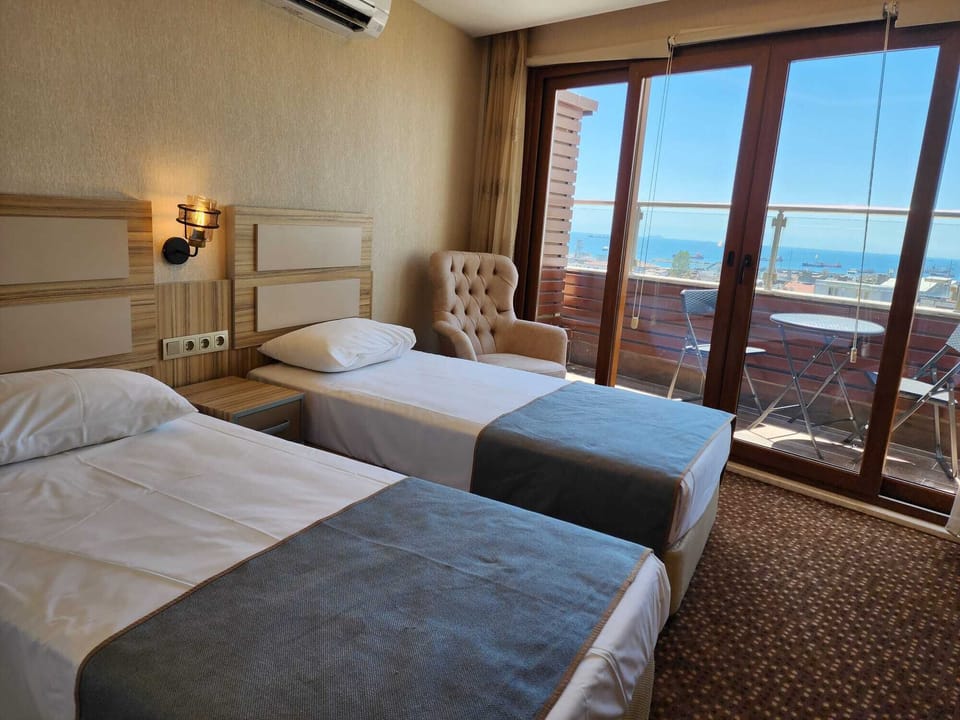 Family Room, Balcony | Minibar, in-room safe, desk, free WiFi