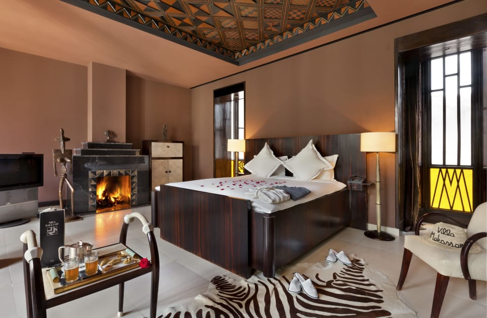 Luxury Suite, 1 King Bed, Fireplace | Premium bedding, minibar, in-room safe, individually decorated