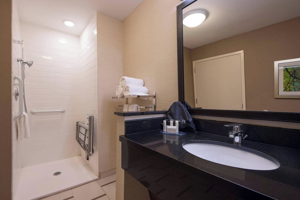 Room, 2 Double Beds, Hearing Accessible (Roll-in Shower) | Bathroom | Combined shower/tub, hair dryer, towels