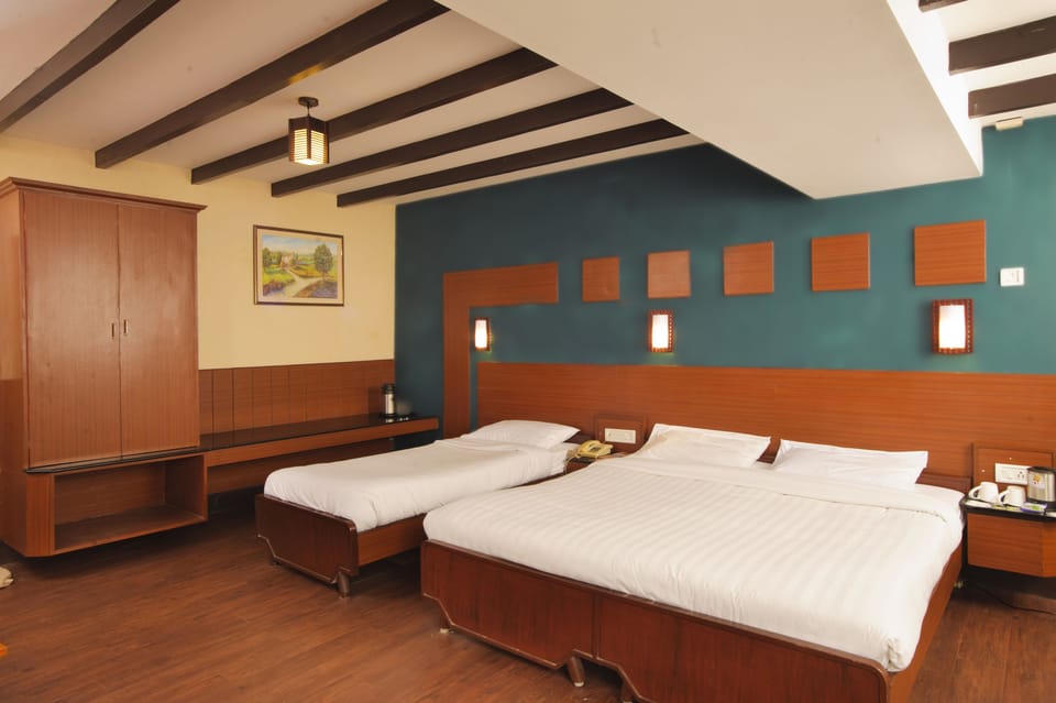 Family Triple Room, 2 Double Beds | In-room safe, rollaway beds, free WiFi