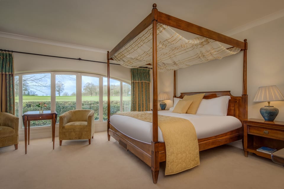 Suite (4 poster) | In-room safe, individually decorated, desk, iron/ironing board