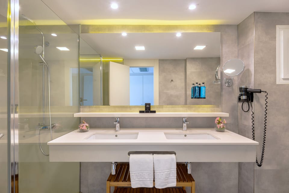 Shower, eco-friendly toiletries, hair dryer, slippers
