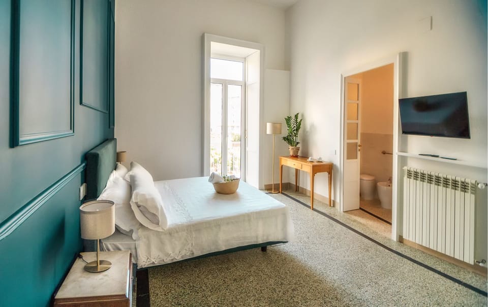 Deluxe Quadruple Room | Premium bedding, down comforters, minibar, individually decorated